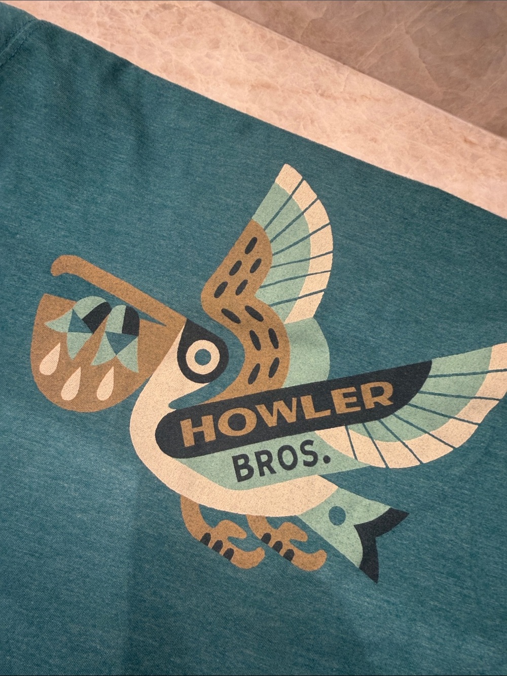 Howler Brothers Teal Throw with Multicolor Pelican Graphic